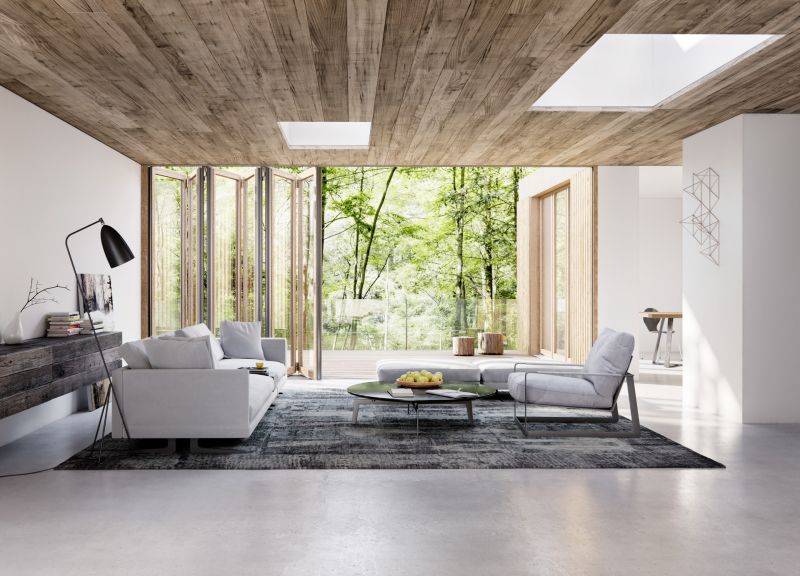 Wohnzimmer mit großen Glas-Faltwänden von Solarlux 